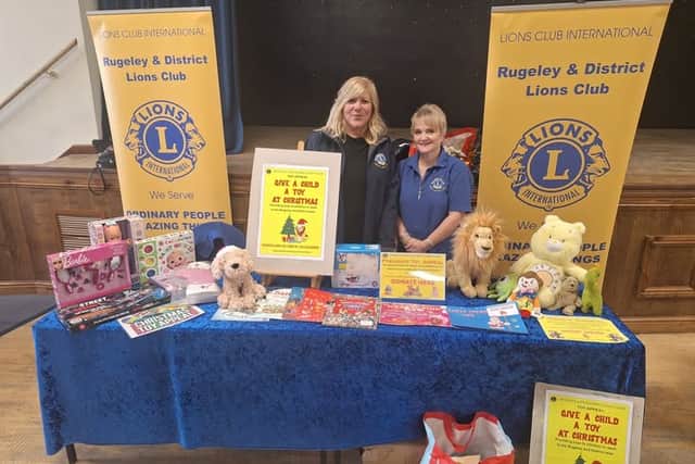 President Debra Coburn with Lion Elaine Morgan at a toy collecting event.