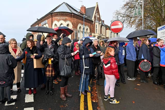 People gather in the road, which was closed off for the unveiling. Photo: Tim Thursfield