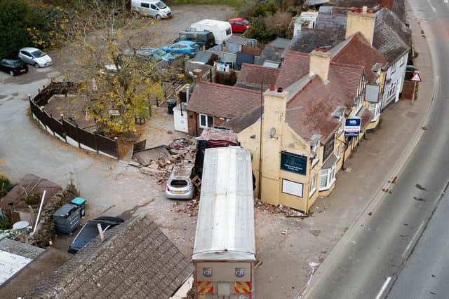 The lorry driver had to be cut free after the vehicle ploughed into the buildings. Picture: Jamie Ricketts