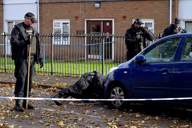 Police and scene of crime officers at Lilleshall Crescent, Wolverhampton, after a murder inquiry is launched after man is shot dead.