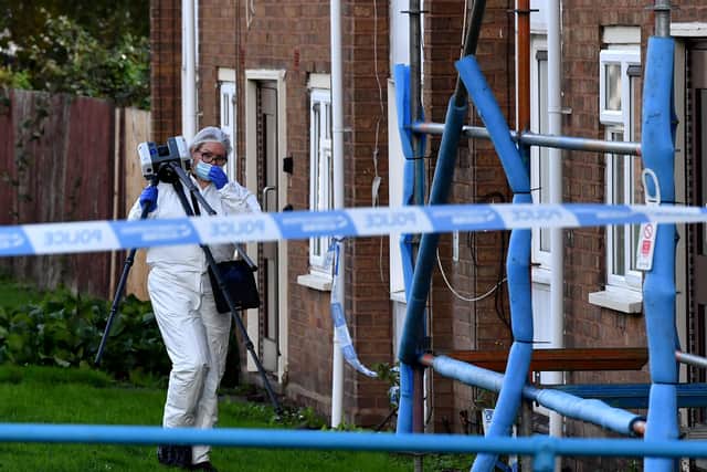Police and scene of crime officers at Lilleshall Crescent, Wolverhampton, after a murder inquiry is launched after man is shot dead.