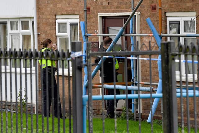 Police and scene of crime officers at Lilleshall Crescent, Wolverhampton, after a murder inquiry is launched after man is shot dead.
