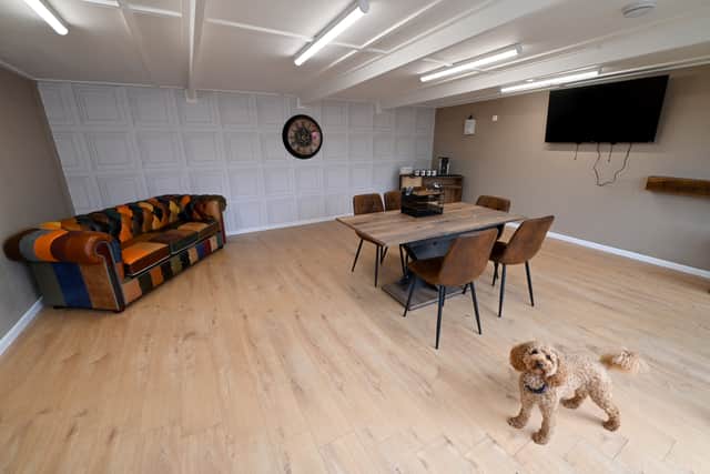 Rufus the school dog checks out the new hub.