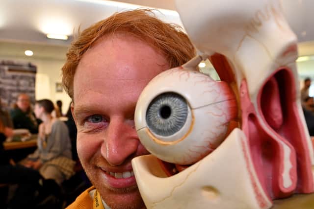Business lecturer Chris Roath eyes up some of the memorabilia on display.