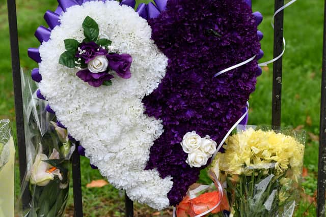 Floral tributes at the scene of the murder in Lilleshall Crescent, Wolverhampton.