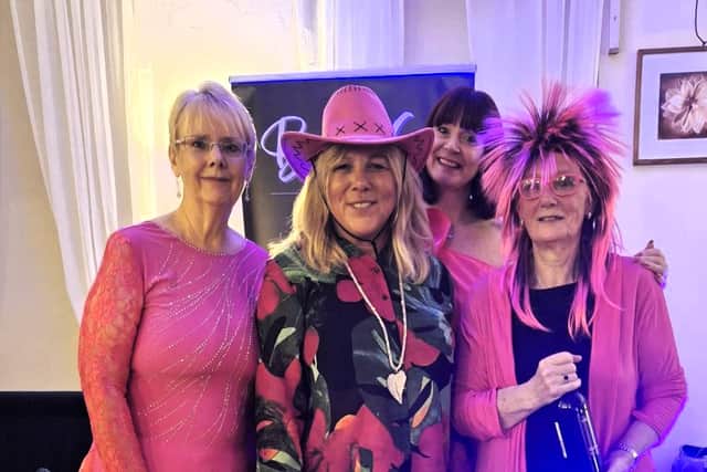 Wear it Pink best dressed winners (from left to right) Mandy, Lions President Debra, Chris with singer Becca G in the back ground