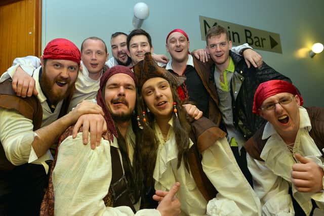 Dean Brawn and Lee Owen (both front centre) are pictured with their pirate mates in 2015