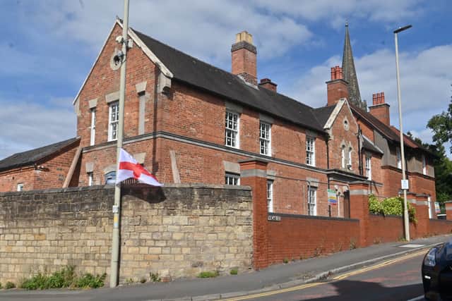 Flags next to the former Police Station, now flats