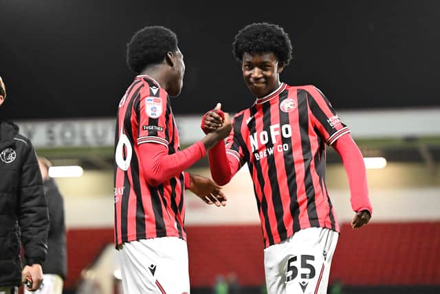 McLloyd Oben (left) celebrates with Paul Makavore (right).