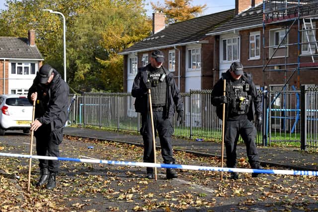 Police and scene of crime officers at Lilleshall Crescent, Wolverhampton, after a murder inquiry is launched after man is shot dead.