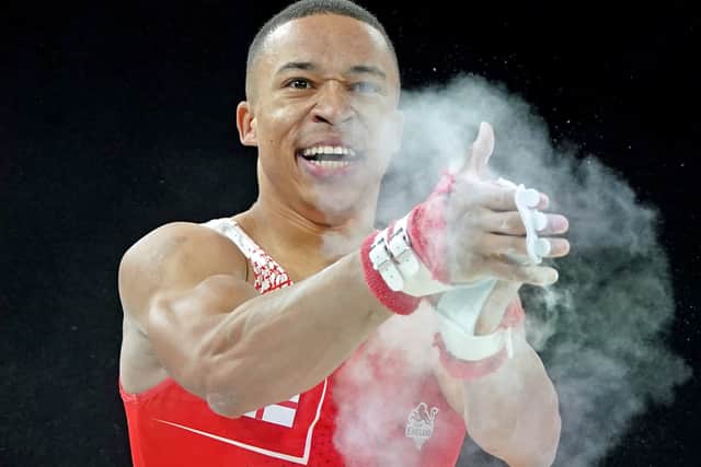 
              
England's Joe Fraser celebrates after his bars rotation of the Men's Team Final and Individual Qualification at Arena Birmingham on day one of the 2022 Commonwealth Games in Birmingham. Picture date: Friday July 29, 2022. PA Photo. See PA story COMMONWEALTH Gymnastics. Photo credit should read: Zac Goodwin/PA Wire.


RESTRICTIONS: Use subject to restrictions. Editorial 
use only, no commercial use without prior consent from rights holder.
            
