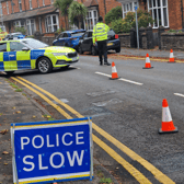Police in Corporation Street, Stafford, after two children were pronounced dead early on Sunday