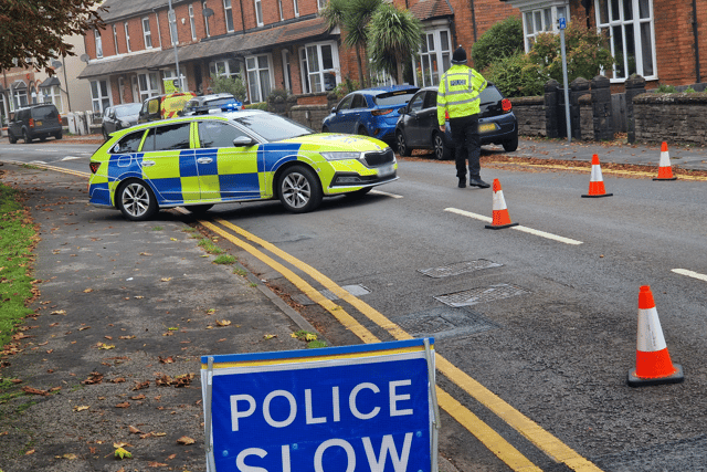 Police in Corporation Street, Stafford, after two children were pronounced dead early on Sunday
