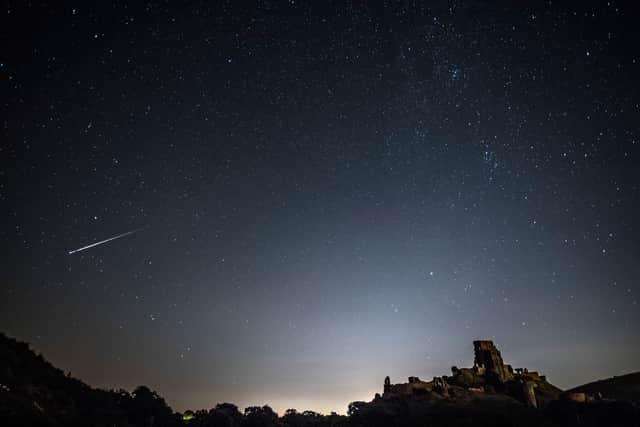 A meteor shoots across the night sky in the UK.