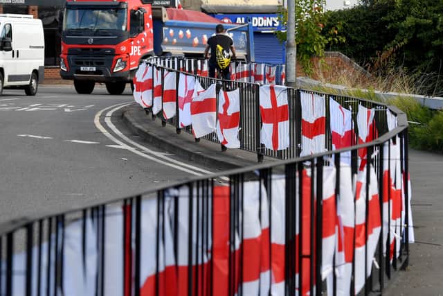 The flags are also placed on the railings surrounding the roundabout. Photo: Tim Thursfield