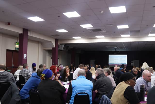 Table discussions among professionals and community members.