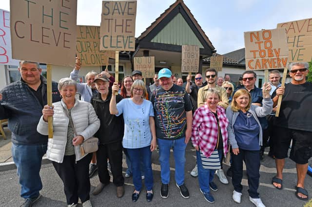 Dozens of people protested outside of the Cleveland Arms on May 31, raising concerns over potential changes