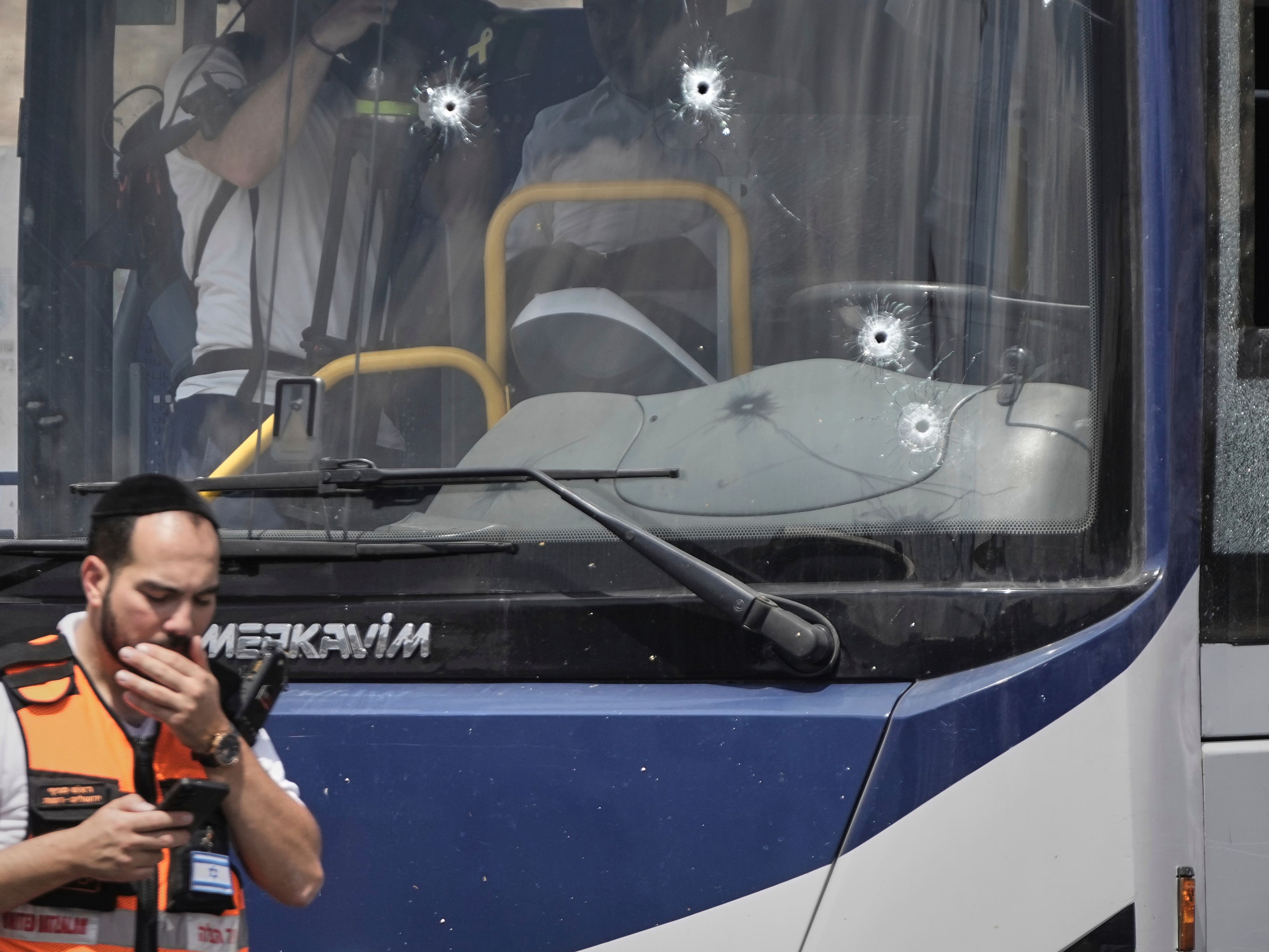 Palestinian gunmen open fire at Jerusalem bus stop, killing six