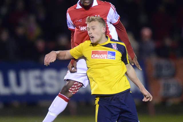 Chey Dunkley of Kidderminster Harriers and Jayden Stockley of Woking