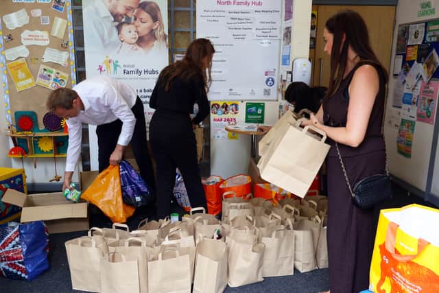 Opus People Solutions packing food parcels. Picture: Opus People Solutions