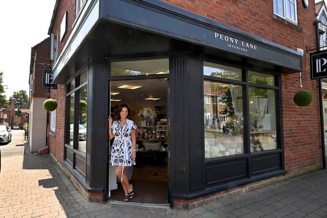 Andrea outside the shop