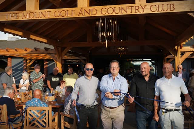 Mike Wood cuts the ribbon at the Mount Golf and Country Club with members of the Bernard family