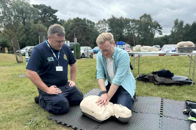 Josh Newberry MP learning CPR skills