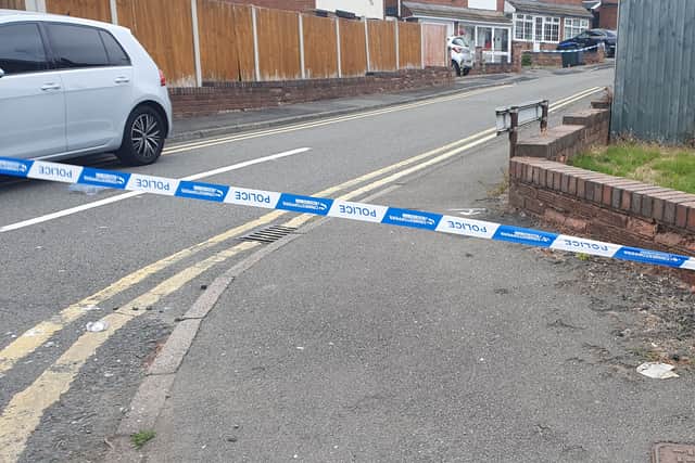 The road was cordoned off at both ends hours after the stabbing