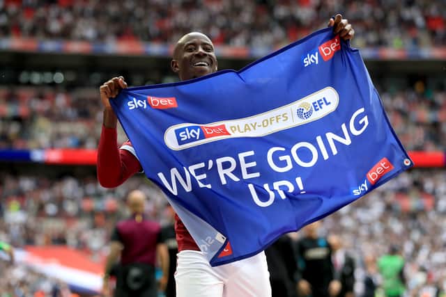 Albert Adomah celebrating promotion to the Premier League with Aston Villa in 2019.
