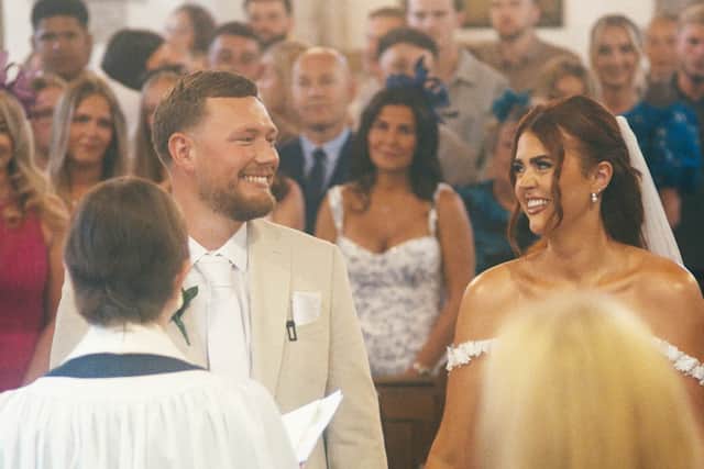 Joe and Tori during their surprise wedding at Studley Parish Church. 