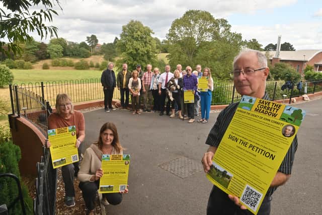 Amblecote resident Helen Cook, Stourbridge MP Cat Eccles and action group spokesman Lance Cartwright with fellow campaigners - with Corbett Meadow to the rear