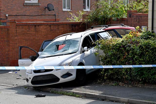 A badly damaged car at the scene in Arbour Drive Photo: Tim Thursfield