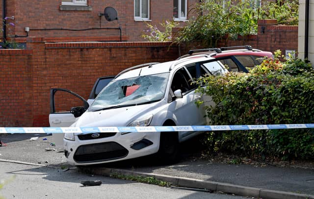 A badly damaged car at the scene in Arbour Drive Photo: Tim Thursfield