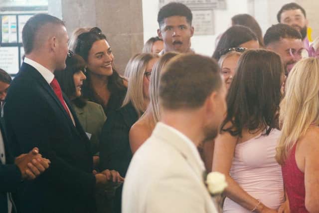The guests' reaction to the Joe and Tori's surprise wedding at Studley Parish Church.