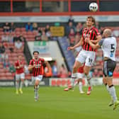 Walsall striker Aaron Pressley battles for the ball against Derby.