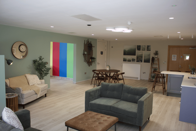 The new family lounge features comfortable sofas, a television, and kitchen facilities allowing visitors to make drinks and food.