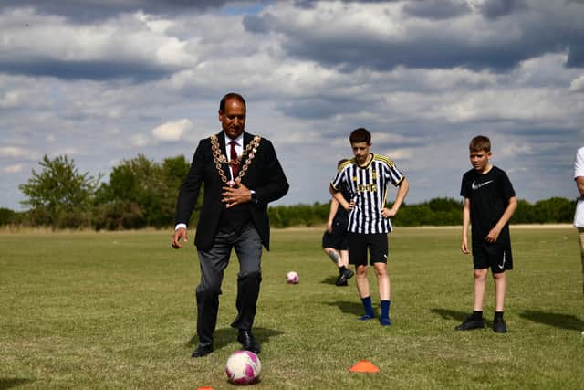 The Lord Mayor playing football with young people at Alvechurch FC. Photo: William Baldwin