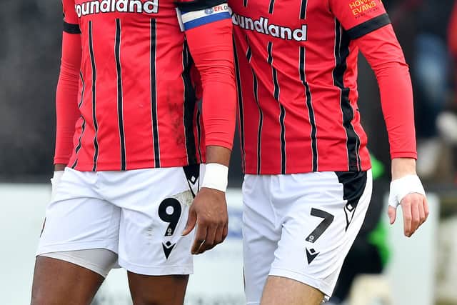Jamille Matt celebrates with former Walsall strike partner Nathan Lowe after scoring in a club record 5-1 win over Tranmere in January.
