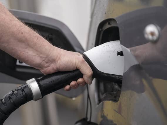 Road signs for electric vehicle (EV) charging hubs will be introduced on major A roads, the Department for Transport (DfT) has announced (Danny Lawson/PA)