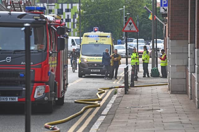 Fire crews respond to the fire in the Beatties building