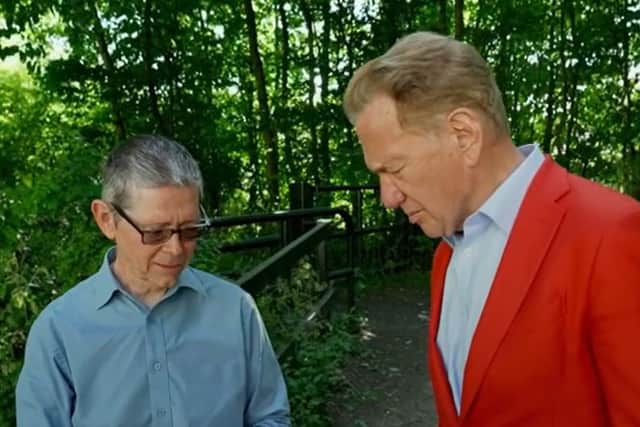Geologist Graham Worton shows television presenter Michael Portillo a Dudley Bug trilobite fossil at Wren's Nest