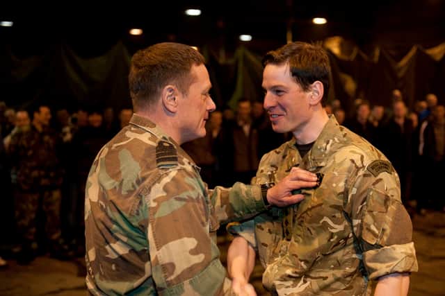 Alex Ballinger, right, during his time in the Army
