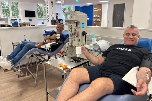 Paul Cadman, right, donating plasma with his friend Phil Upton, left, at the NHS donor centre in Birmingham.