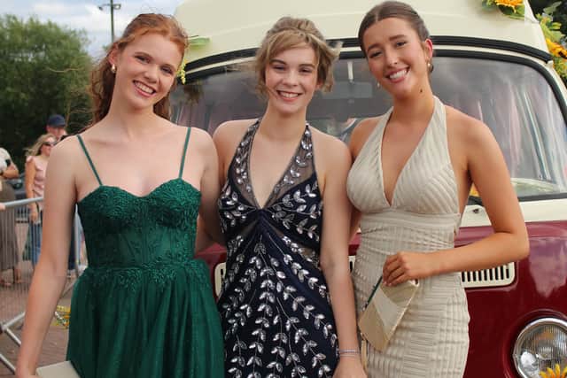 Eleanor Cowing, Arrabella Sutton Dunn and Gabrielle Thornton arriving to prom in their vintage VW Camper Van decorated in sunflowers.