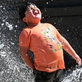 Children enjoying the water feature in Queen Square, Wolverhampton in a previous year