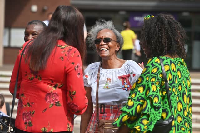 All smiles: Mel Chevannes CBE the first African Caribbean councillor in Wolverhampton speaks to some friends at the Windrush day celebration