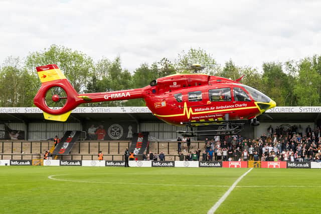 There was a rather dramatic scene at the end of Hednesford's play-off triumph as the air ambulance landed on the pitch at the end of the game to airlift a supporter to hospital after they suffered a heart attack during the celebrations (Picture: Jim Wall)