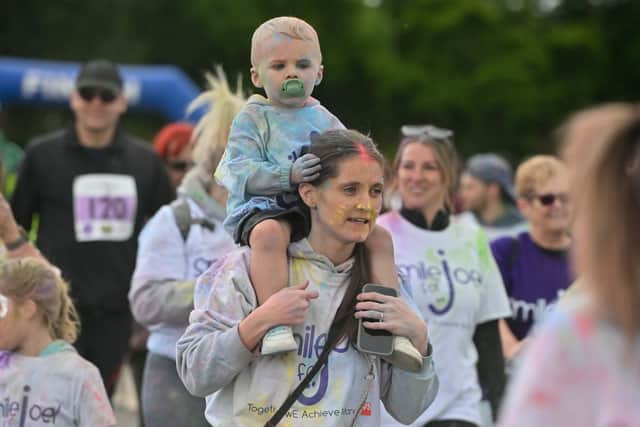 Almost 400 people took part in the colour run event to raise money and remember those lost