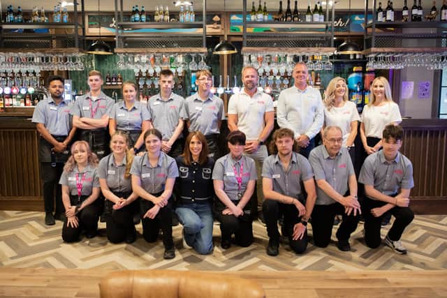 Team line-up: Alex Jones meets the staff at the Wonky Donkey.