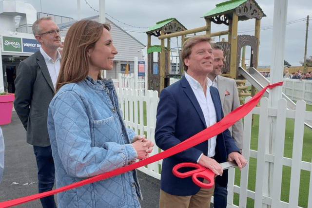 Unity Beach's chief operating officer Dermot King prepares to hand the giant scissors to Alex Jones as she officially unveils the new facilities at the Somerset holiday park.